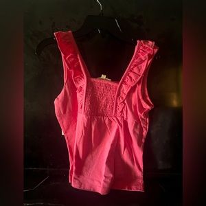 Girls, pink umpire tank top that is perfect for hanging out, or dressing up!